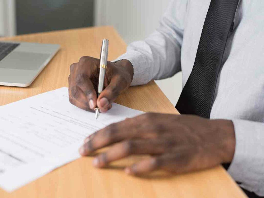 Person signing paperwork